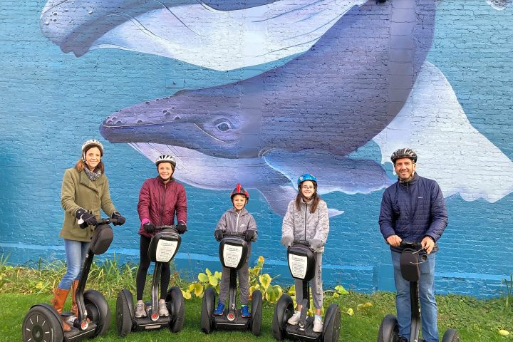 Art in Sheboygan with a huge whale on the wall and Segwayists posing